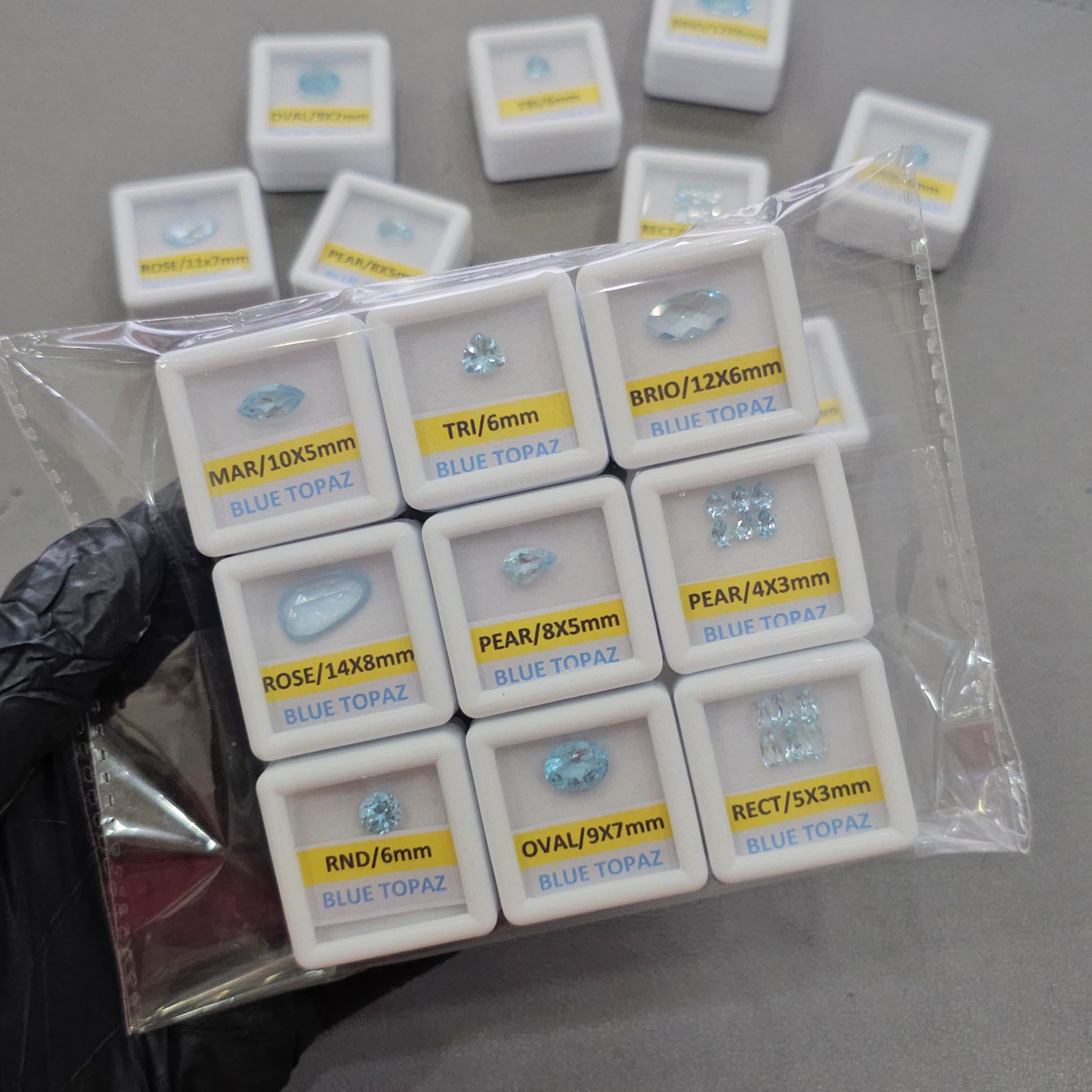 9 Boxes of Natural Blue Topaz | 4–14mm | Premium Quality Gemstones with Boxes - The LabradoriteKing