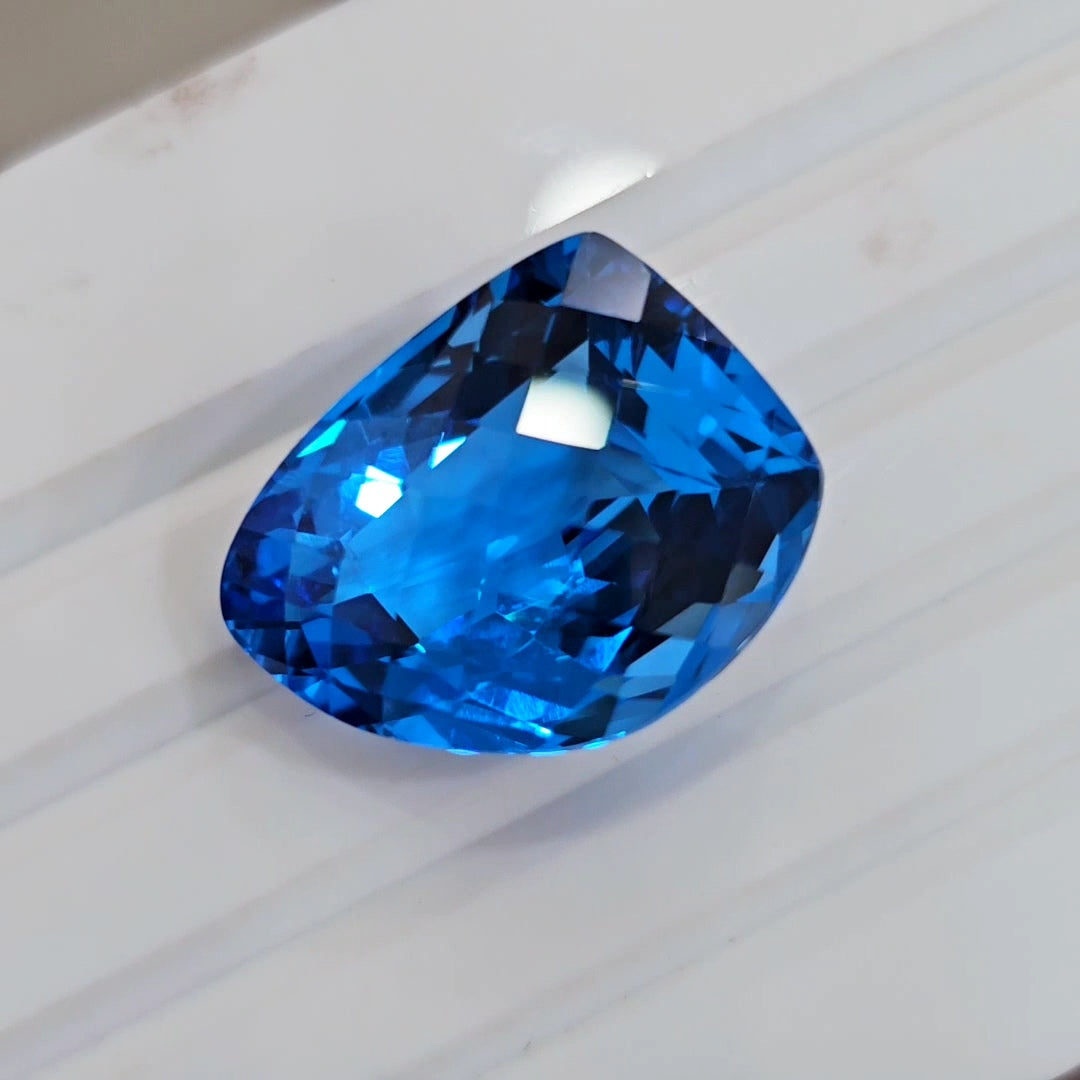 34.8Cts Of Natural Swiss Blue Topaz Checker Cut | Fancy | 22x17mm - The LabradoriteKing