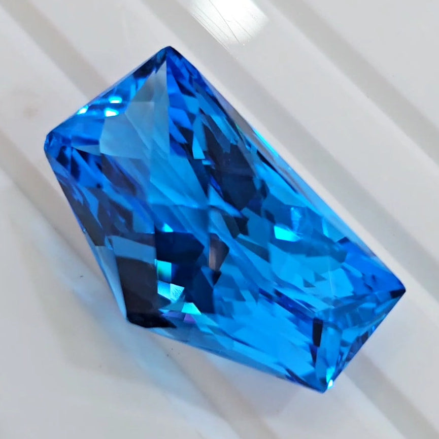 54.4Cts Of Natural Swiss Blue Topaz Checker Cut | Fancy | 29x17mm - The LabradoriteKing