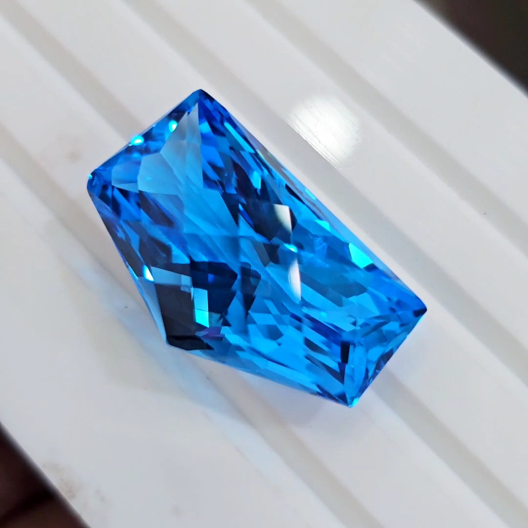 54.4Cts Of Natural Swiss Blue Topaz Checker Cut | Fancy | 29x17mm - The LabradoriteKing