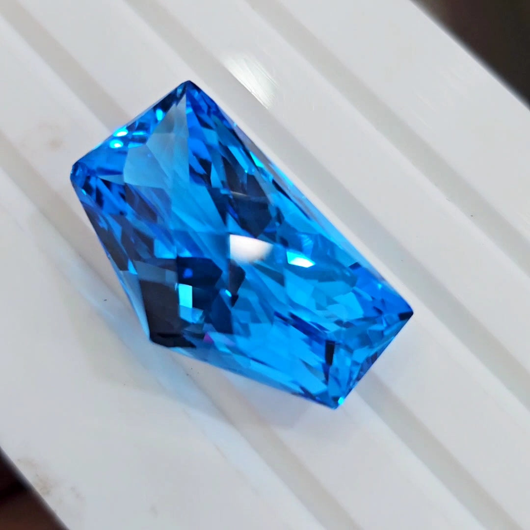 54.4Cts Of Natural Swiss Blue Topaz Checker Cut | Fancy | 29x17mm - The LabradoriteKing