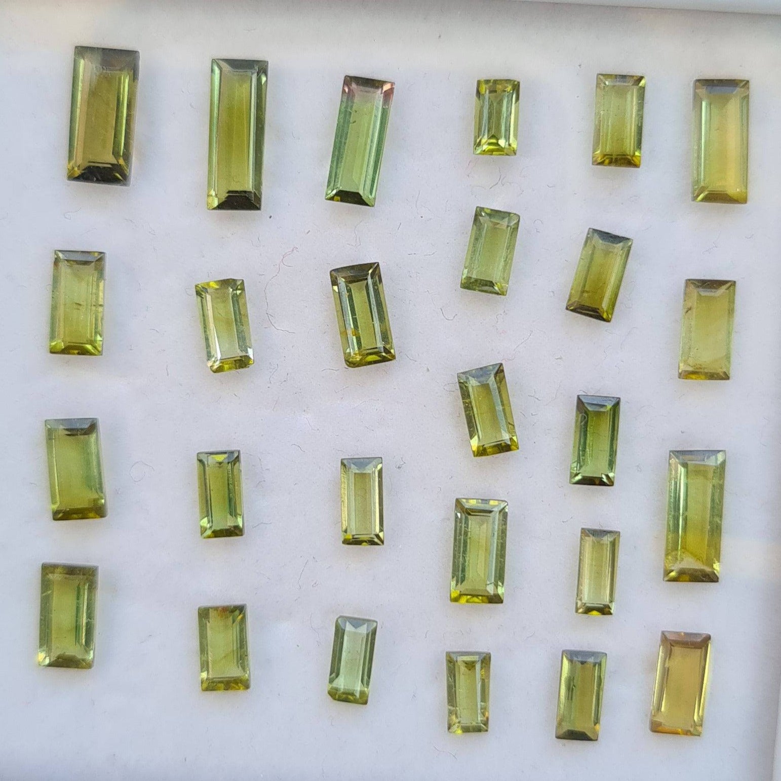 26 Pcs Natural Lite Green Tourmaline Faceted Gemstones Baguette Shape, 5-9mm - The LabradoriteKing