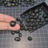Load image into Gallery viewer, 15 Pcs Black Star Diopside from India | Natural 10-15mm Cabochons - The LabradoriteKing